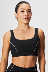 medium impact piped sports bra